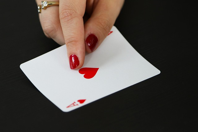 Close-up of a hand holding a deck of playing cards, ready for a game